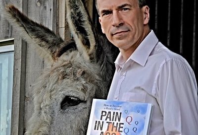 Dr. Christopher DiCarlo seen with his book