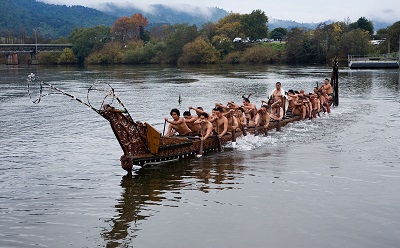 Maori People in Canoe