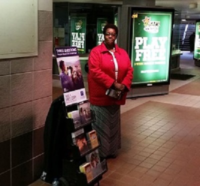 Woman with Leaflets in Boston terminal